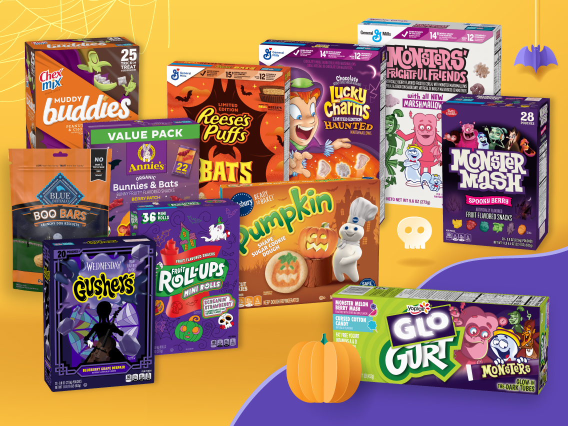 Display of General Mills Halloween product packaging from Monsters Cereal, Annie's, Chex Mix, Fruit Roll-Ups, Go-GURT, Gushers, Lucky Charms, Pillsbury, Reese's Puffs, and Blue Buffalo.